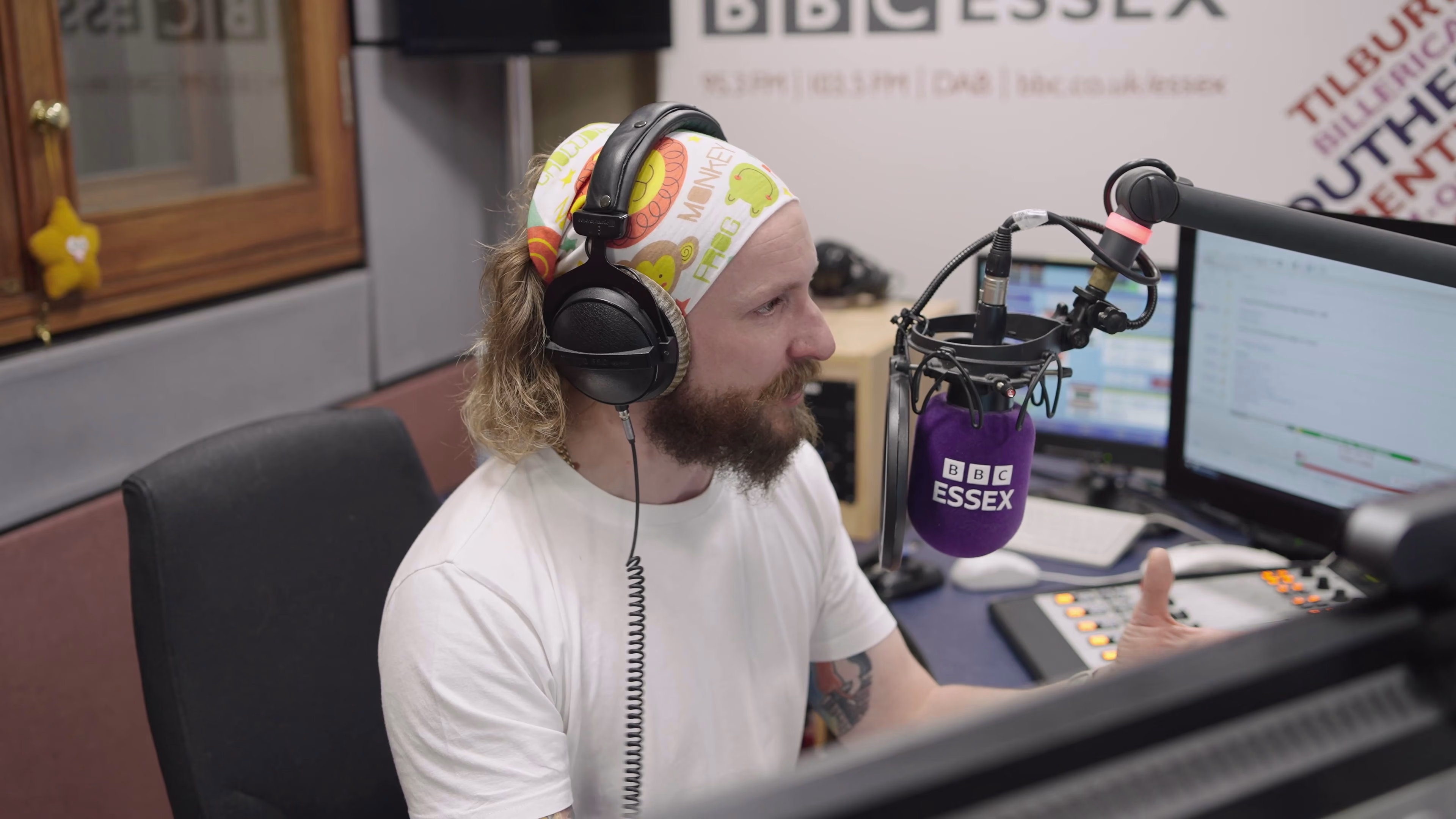 Radio presenter at the microphone in the studio